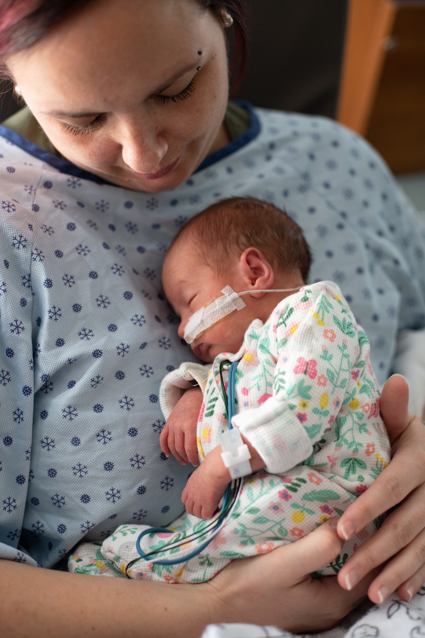 Mother taking care of his premature baby at hospital